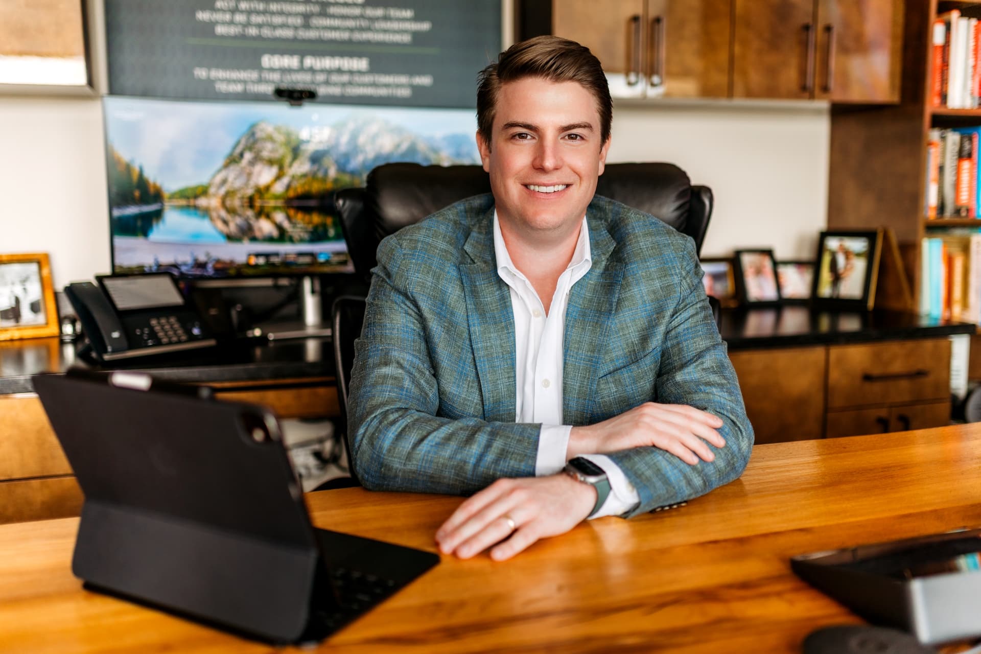 rhodes-enterprises-in-office-with-tablet-vantage-bank